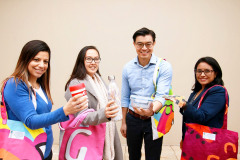 Council-Staff-displaying-usable-products-including-Banner-Bags-for-Plastic-Free-July-Promotion